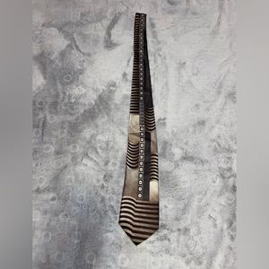 Dark Horse tie in a variety of shades of brown 100% polyester